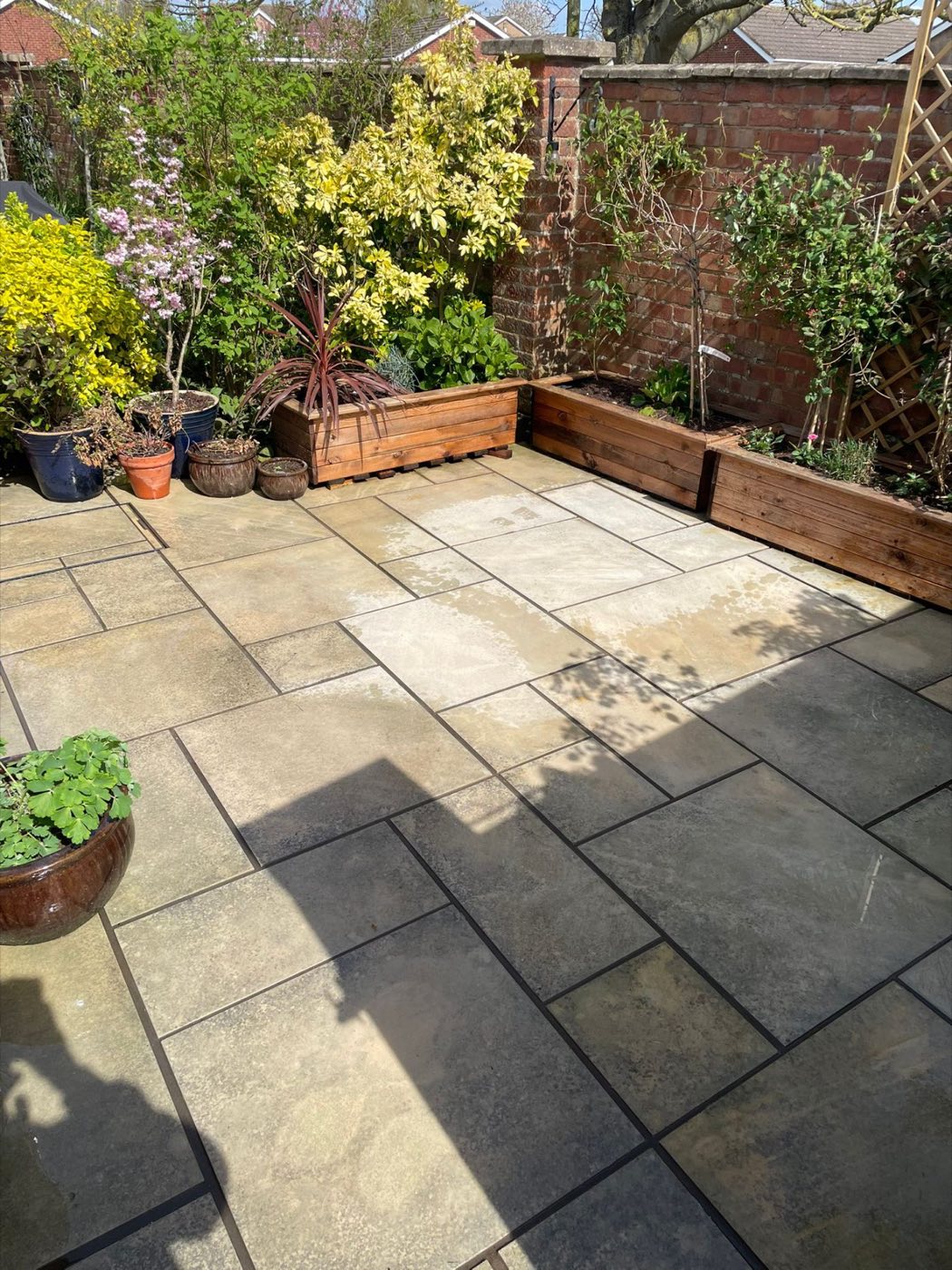 Clean buff patio with planters
